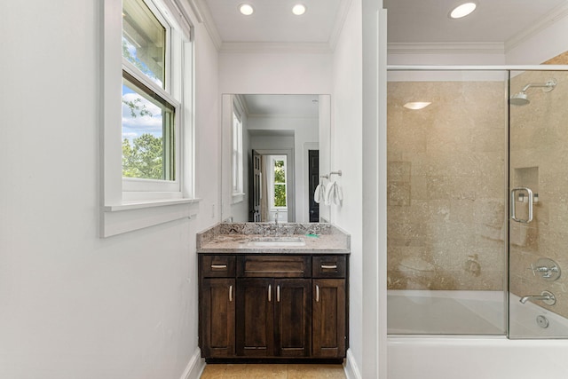 bathroom featuring combined bath / shower with glass door, vanity, and crown molding