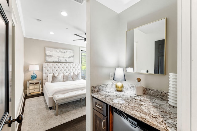 bedroom with ornamental molding and dark hardwood / wood-style flooring