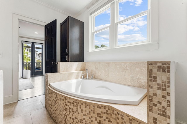 bathroom featuring ornamental molding, a relaxing tiled bath, and tile floors