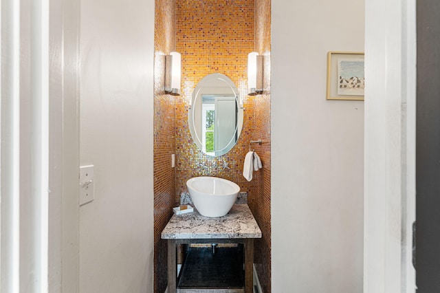 details featuring tasteful backsplash and vanity