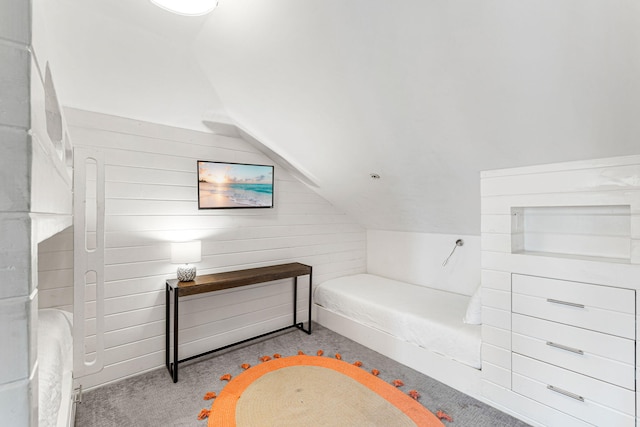 carpeted bedroom with vaulted ceiling