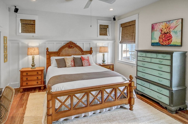 bedroom featuring light hardwood / wood-style floors and ceiling fan