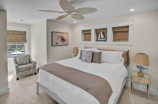 carpeted bedroom featuring ceiling fan