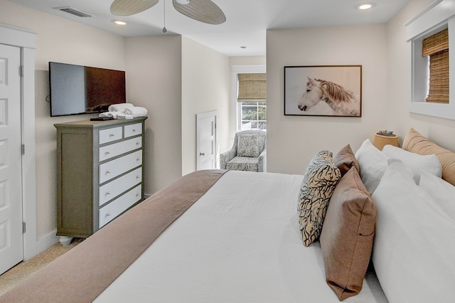 carpeted bedroom featuring ceiling fan