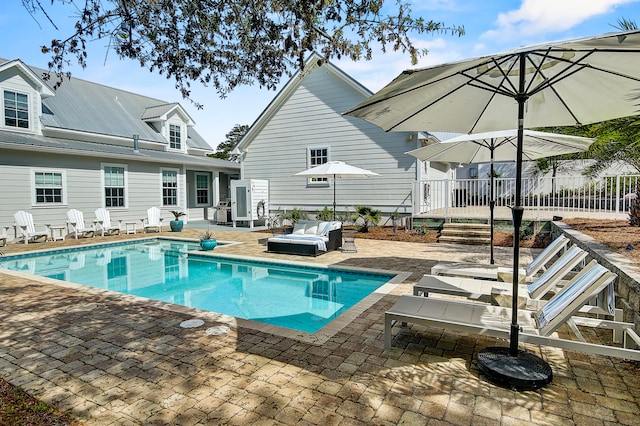 view of pool featuring a patio and outdoor lounge area