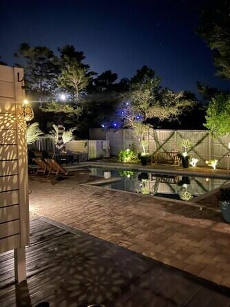 view of patio terrace at night