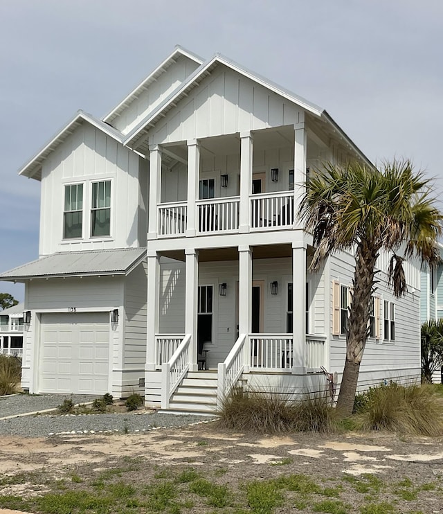 view of front of property featuring covered porch and a garage