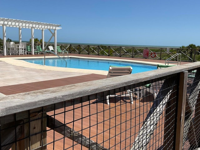 view of swimming pool with a pergola