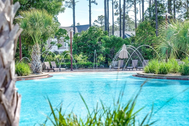 view of pool featuring pool water feature