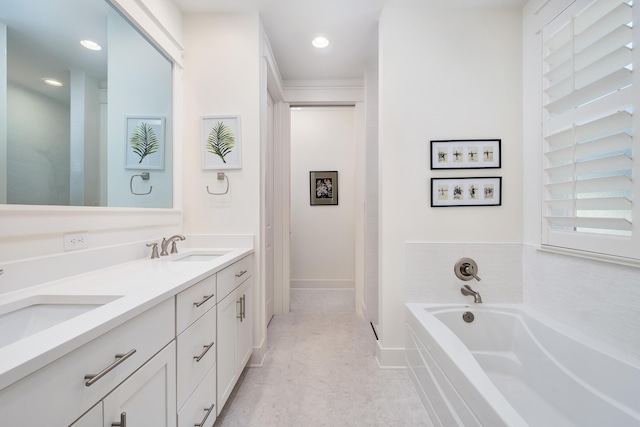 bathroom featuring vanity and a bathing tub