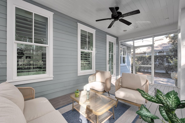 sunroom featuring wooden ceiling and ceiling fan