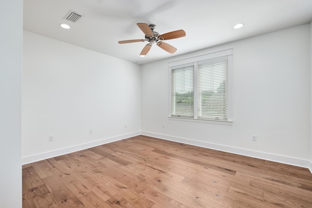 empty room with light hardwood / wood-style floors and ceiling fan