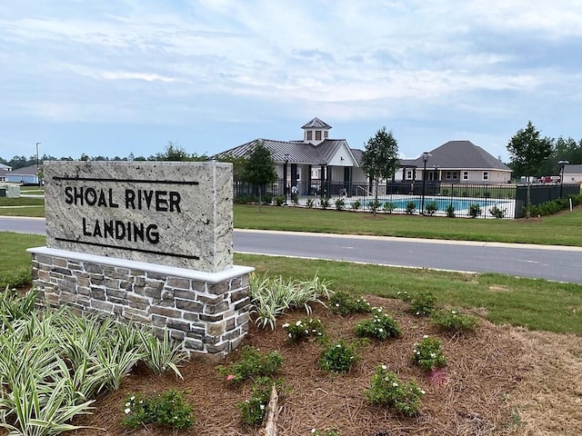 community sign with a lawn