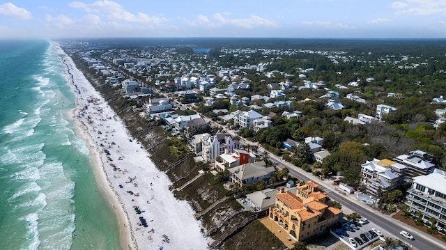 bird's eye view featuring a water view and a view of the beach