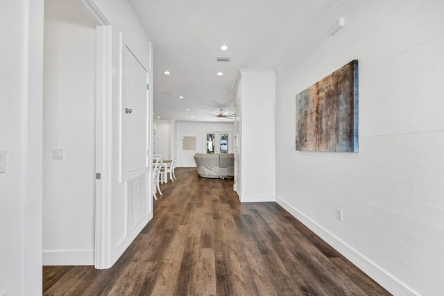 hallway featuring dark hardwood / wood-style flooring