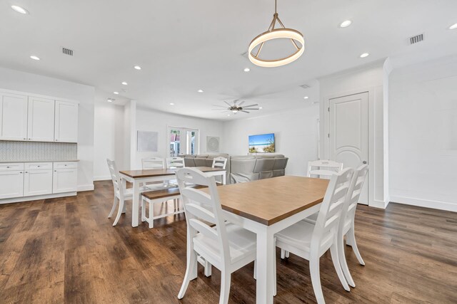 dining room featuring dark wood-type flooring and ceiling fan