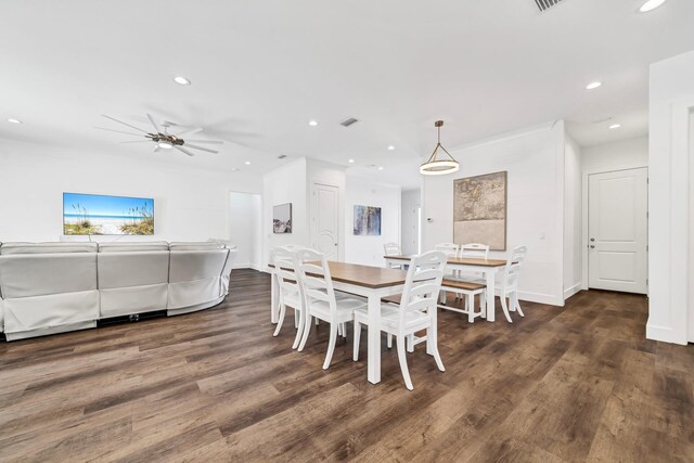 dining area featuring ceiling fan and dark hardwood / wood-style floors