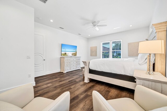 bedroom featuring dark hardwood / wood-style flooring and ceiling fan