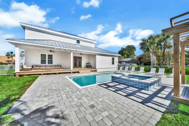 view of swimming pool featuring an in ground hot tub, outdoor lounge area, and a patio