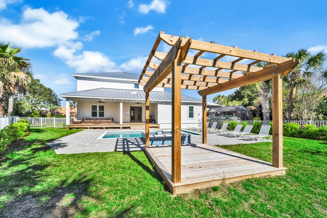 exterior space with a yard, a pergola, and a pool side deck