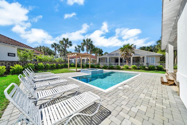 view of swimming pool featuring a pergola and a patio area