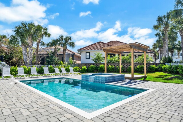 view of swimming pool featuring a pergola, a patio, and an in ground hot tub