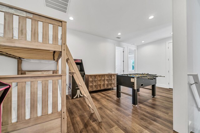 recreation room with hardwood / wood-style floors