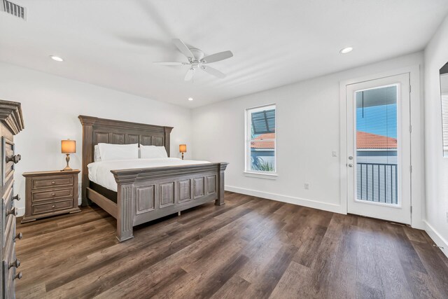 bedroom featuring dark hardwood / wood-style flooring, access to exterior, and ceiling fan