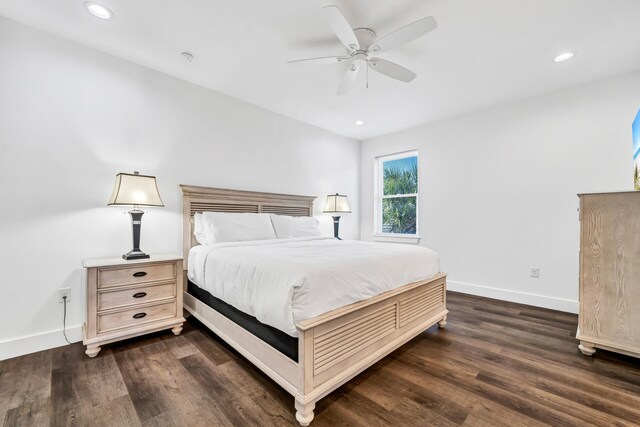 bedroom featuring ceiling fan and dark hardwood / wood-style floors