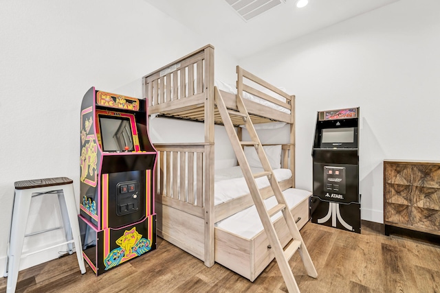 bedroom with hardwood / wood-style flooring