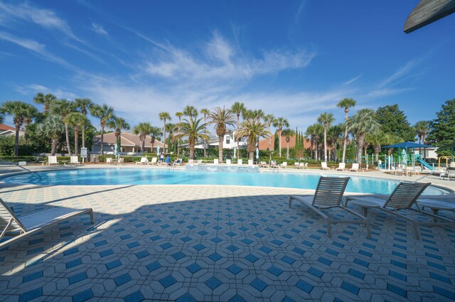 view of swimming pool with a patio area