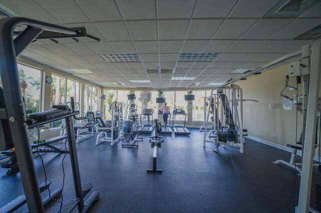 workout area with a paneled ceiling