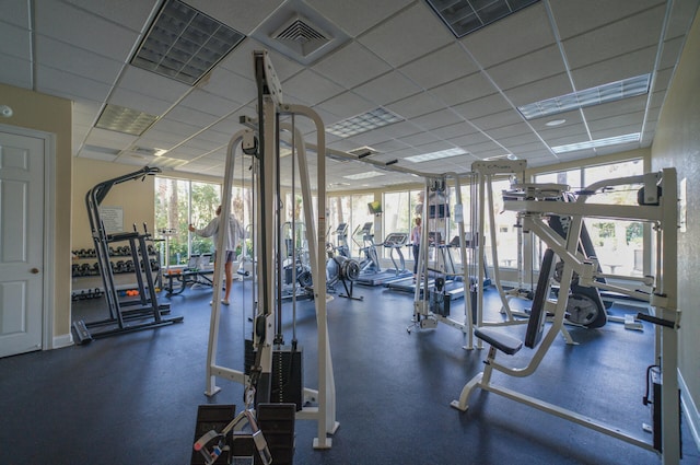 exercise room with a drop ceiling