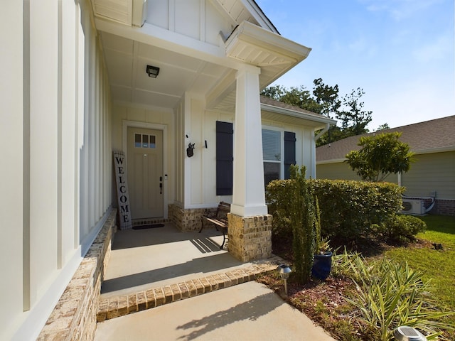 view of exterior entry featuring a porch