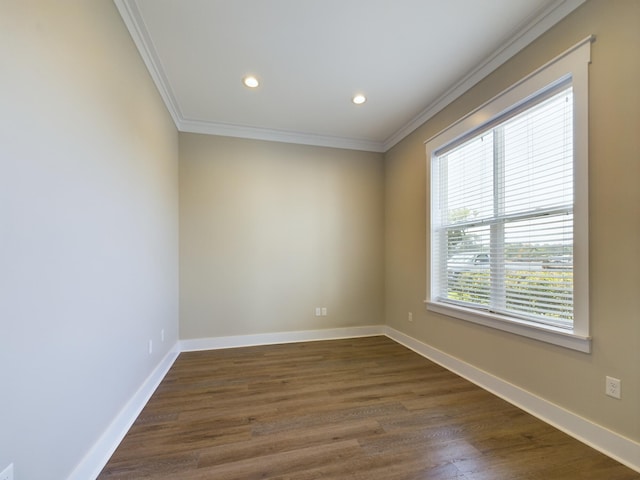 spare room with dark hardwood / wood-style floors and ornamental molding