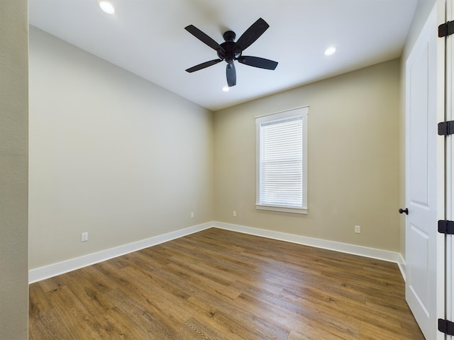 empty room featuring wood-type flooring and ceiling fan