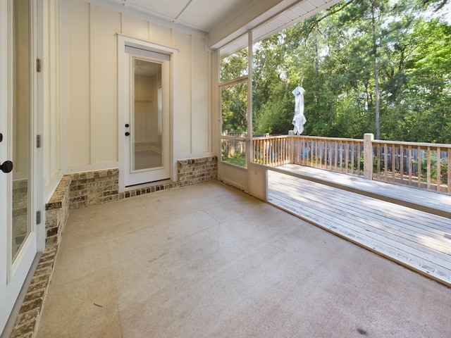 unfurnished sunroom featuring a wealth of natural light