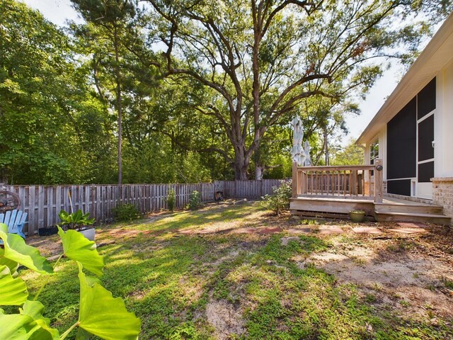 view of yard featuring a wooden deck