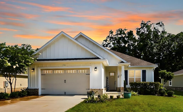 craftsman house with a lawn and a garage