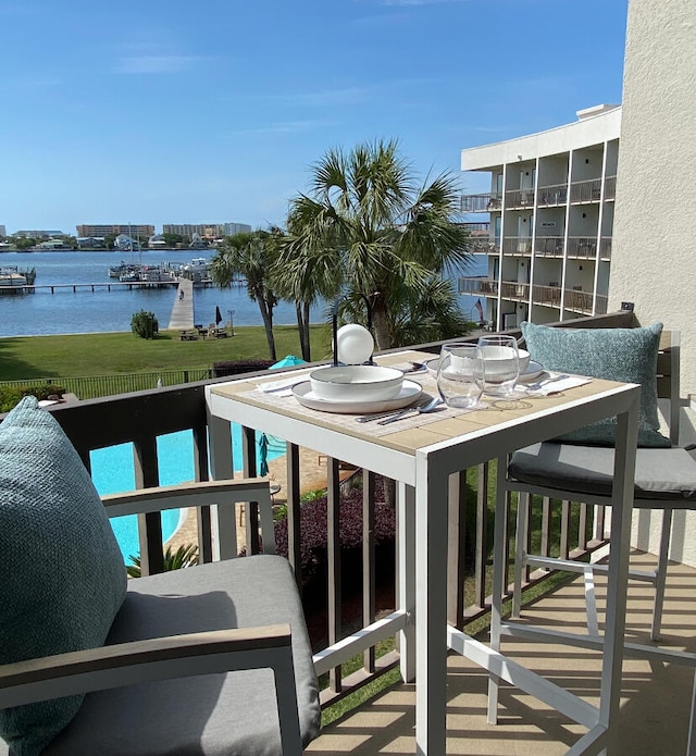 balcony featuring a water view