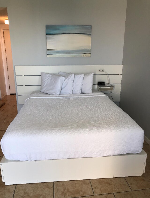 bedroom with tile floors