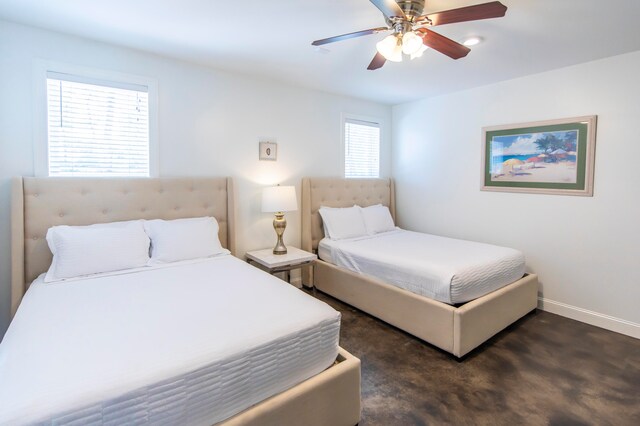 bedroom featuring ceiling fan and multiple windows