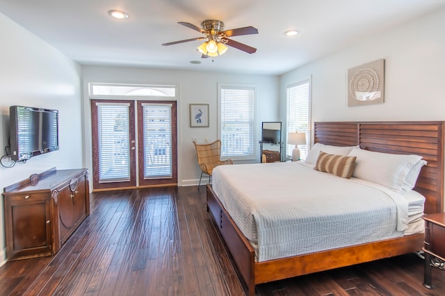 bedroom featuring dark hardwood / wood-style floors, access to exterior, ceiling fan, and french doors