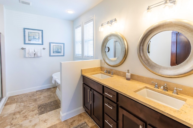 bathroom with tile floors and dual vanity