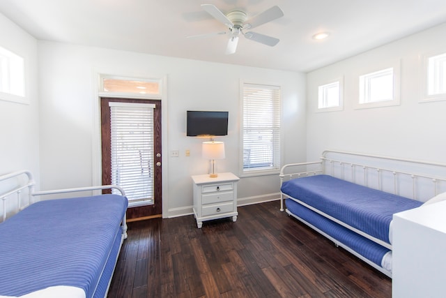 bedroom with ceiling fan and dark hardwood / wood-style floors