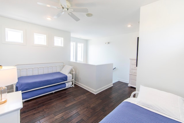 bedroom featuring dark hardwood / wood-style flooring and ceiling fan