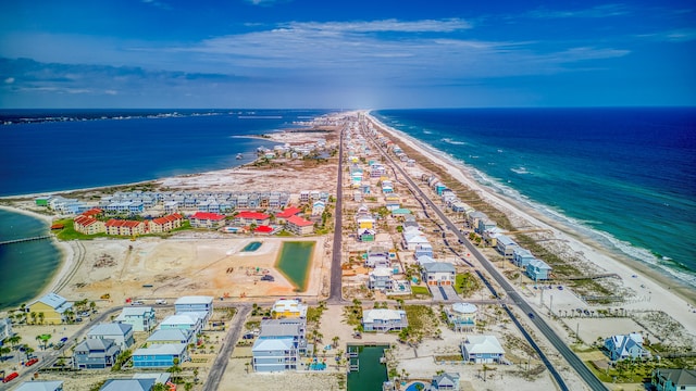 aerial view with a water view and a view of the beach