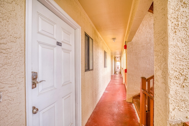 hall featuring ornamental molding