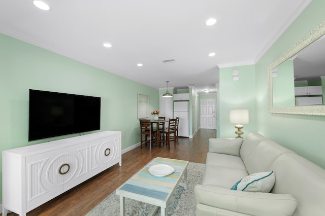 living room featuring dark hardwood / wood-style flooring and crown molding