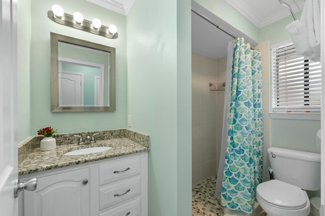 bathroom with curtained shower, large vanity, crown molding, and toilet